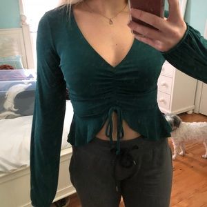 Cropped green long sleeve top